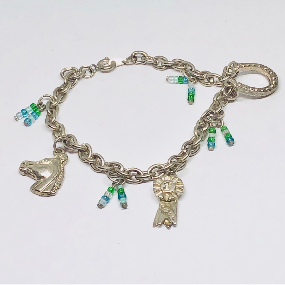 Silver tone charms bracelet